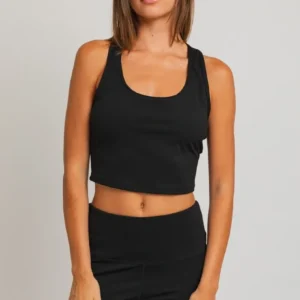 A woman wearing black is standing up