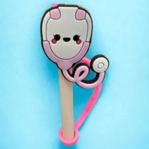 A pink and white toothbrush with a face on it.