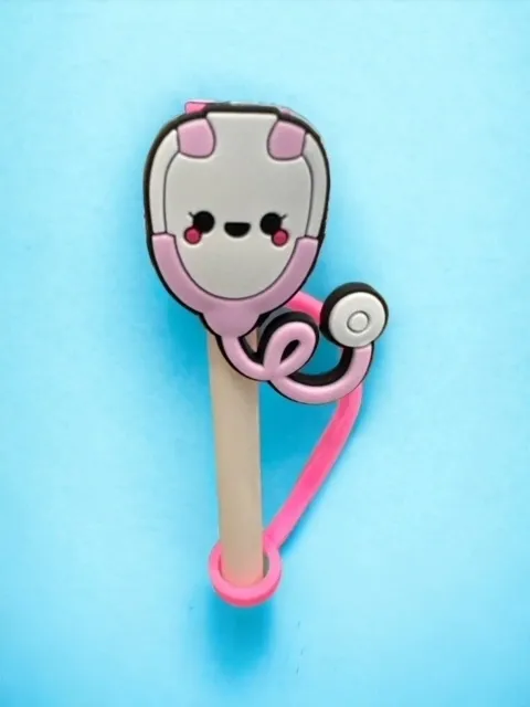 A pink and white toothbrush with a face on it.