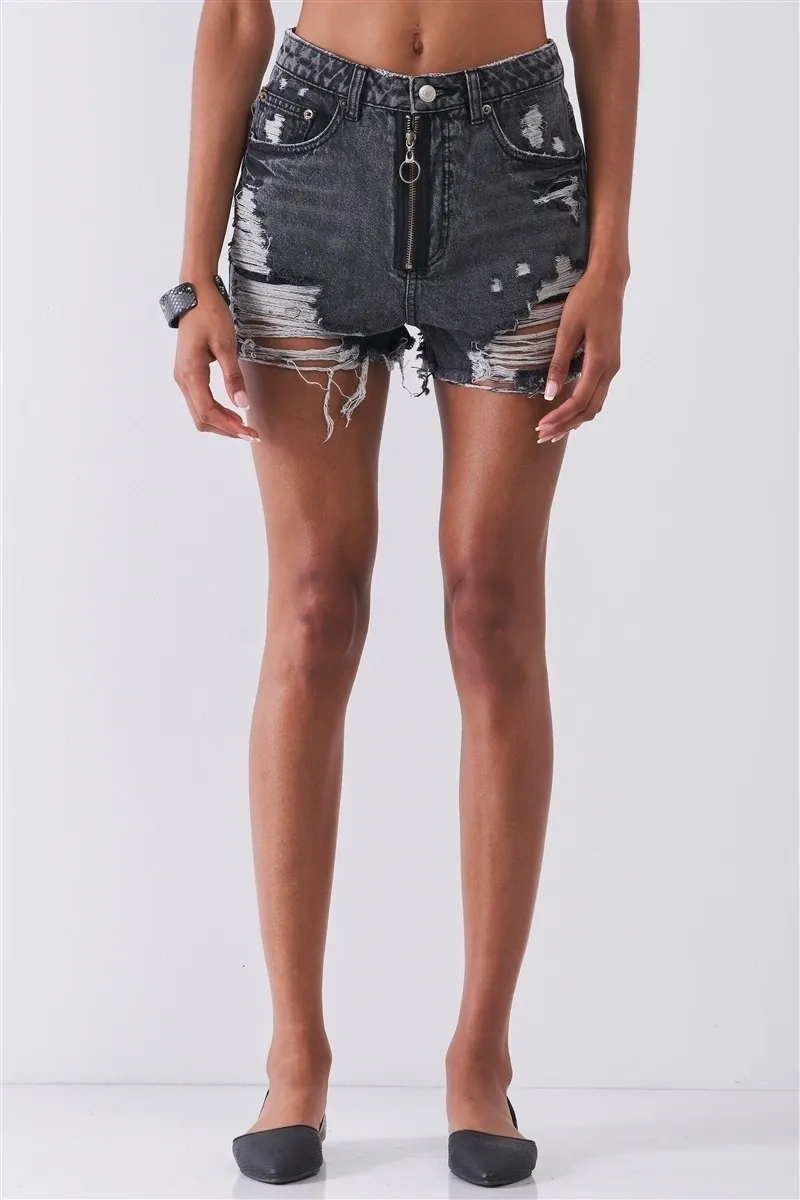 A person wearing shorts with holes and metal plates on them.