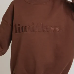 A brown sweatshirt with the word limitless written on it.