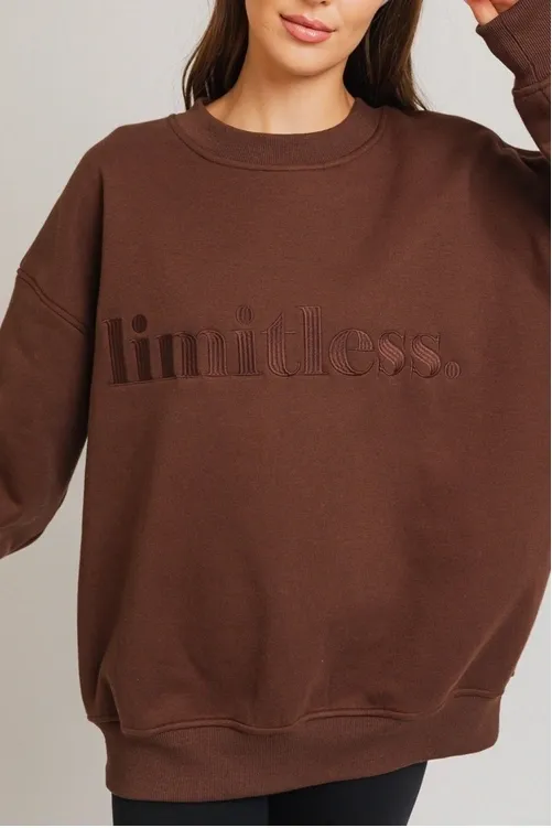 A brown sweatshirt with the word limitless written on it.