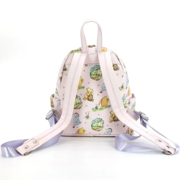 Pink Winnie the Pooh backpack with straps.