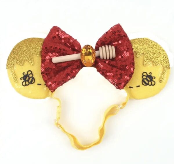 Honeycomb ears with red bow and bee