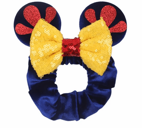 Blue velvet headband with yellow bow and red ears.