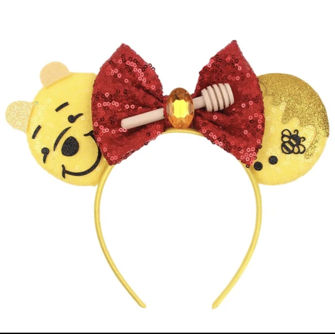 Winnie the Pooh headband with bow and honey stick.