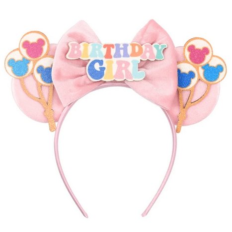 Pink birthday headband with balloons and ears.