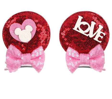 Red sequin hair clips with love and heart designs.