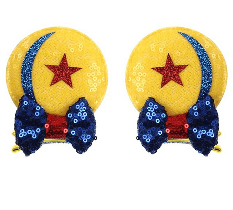 Yellow star hair clips with blue bows.