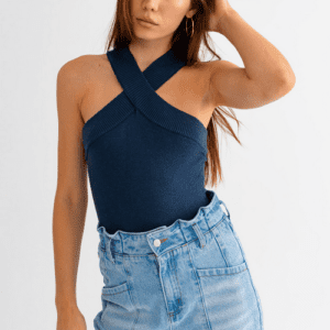 Woman in blue halter top and jeans.