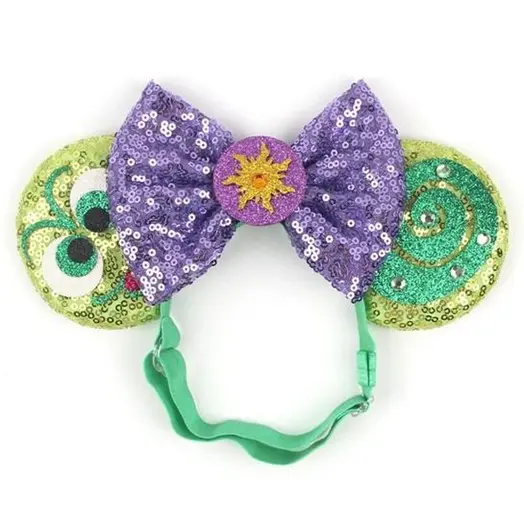 Purple and green sparkly headband with sun.