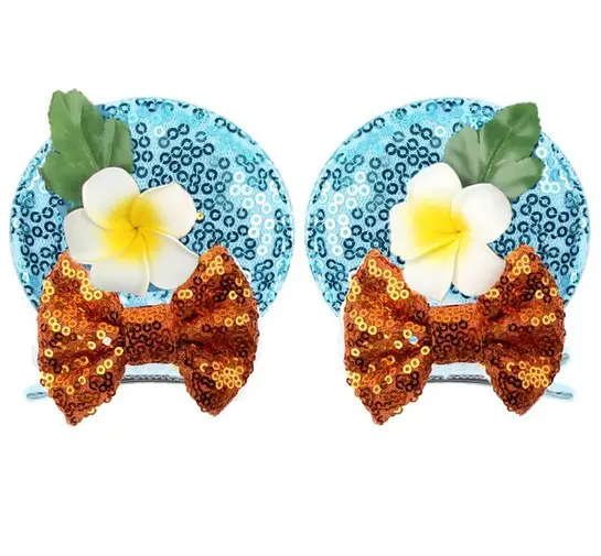 Blue and orange sequin hair clips with flowers.